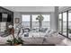 Bright living room with water views, comfy seating, and large windows at 100 Murray Blvd, Charleston, SC 29401