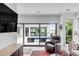 Living area with sliding doors opening to a pool and patio at 100 Murray Blvd, Charleston, SC 29401