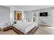 Main bedroom with water views and wood platform bed at 100 Murray Blvd, Charleston, SC 29401