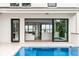 Luxury home with a view of the pool and kitchen through sliding glass doors at 100 Murray Blvd, Charleston, SC 29401