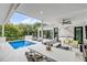Stunning outdoor space with a pool, patio furniture, and a dining area at 100 Murray Blvd, Charleston, SC 29401