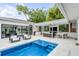 Outdoor oasis with a refreshing pool and a covered patio perfect for entertaining at 100 Murray Blvd, Charleston, SC 29401