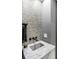 Stylish powder room with marble vanity and unique tile at 100 Murray Blvd, Charleston, SC 29401