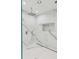 Elegant shower with marble tile and built-in shelf at 100 Murray Blvd, Charleston, SC 29401