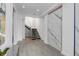 Modern glass staircase with marble wall at 100 Murray Blvd, Charleston, SC 29401