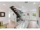 Modern glass and metal staircase between floors at 100 Murray Blvd, Charleston, SC 29401