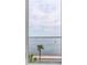 Riverfront view with palm trees and boat at 100 Murray Blvd, Charleston, SC 29401