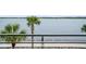 Scenic waterfront view with palm trees and walkway at 100 Murray Blvd, Charleston, SC 29401