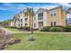 Yellow apartment building with landscaping, sidewalk, and street at 1034 Rosewood Ln, Mount Pleasant, SC 29464