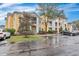 Yellow apartment building with white trim, landscaping, and parking at 1034 Rosewood Ln, Mount Pleasant, SC 29464