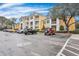 Parking lot with various cars parked in front of yellow apartment building at 1034 Rosewood Ln, Mount Pleasant, SC 29464
