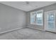 Spacious bedroom with carpet, ceiling fan, and balcony access at 1034 Rosewood Ln, Mount Pleasant, SC 29464