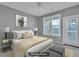 Virtually staged bedroom with private balcony access at 1034 Rosewood Ln, Mount Pleasant, SC 29464
