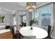 Virtually staged dining area with hardwood floors and modern chandelier at 1034 Rosewood Ln, Mount Pleasant, SC 29464