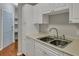 Kitchen features white cabinets, new sink and modern appliances at 1034 Rosewood Ln, Mount Pleasant, SC 29464