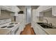 Galley kitchen with white cabinets, and stainless steel sink at 1034 Rosewood Ln, Mount Pleasant, SC 29464