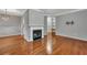 Hardwood floor living room with fireplace and access to dining area at 1034 Rosewood Ln, Mount Pleasant, SC 29464