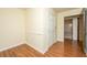 Clean hallway with hardwood floors and access to bathroom at 1061 Dominion Dr, Hanahan, SC 29410