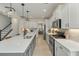 Bright kitchen featuring white cabinets, a large island, and hardwood floors at 113 Surfbird Rd, Summerville, SC 29486