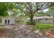 Large backyard with mature trees and detached garage at 1134 Mim Ave, Charleston, SC 29407