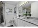 Updated bathroom with granite countertop and gray tile shower at 1134 Mim Ave, Charleston, SC 29407