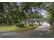 White brick ranch house with mature landscaping at 1134 Mim Ave, Charleston, SC 29407