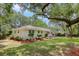 White brick ranch house with mature landscaping at 1134 Mim Ave, Charleston, SC 29407
