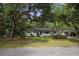 White brick ranch house with mature landscaping at 1134 Mim Ave, Charleston, SC 29407