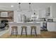 Modern kitchen with white cabinets, stainless steel appliances, and an island at 1134 Mim Ave, Charleston, SC 29407