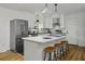 Modern kitchen with white cabinets, stainless steel appliances, and an island at 1134 Mim Ave, Charleston, SC 29407