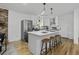 Modern kitchen with white cabinets, stainless steel appliances, and an island at 1134 Mim Ave, Charleston, SC 29407