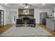 Cozy living room featuring a brick fireplace, hardwood floors, and comfortable seating at 1134 Mim Ave, Charleston, SC 29407