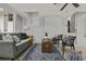 Cozy sunroom with whitewashed brick and tiled floors at 1134 Mim Ave, Charleston, SC 29407