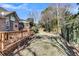 Landscaped backyard with grassy lawn and wooden fence at 1449 Waterside Ct, Mount Pleasant, SC 29464