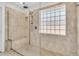Walk-in shower with glass enclosure and neutral tile at 1449 Waterside Ct, Mount Pleasant, SC 29464
