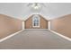 Spacious bonus room with high ceilings, window, and carpet at 1449 Waterside Ct, Mount Pleasant, SC 29464