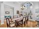 Formal dining room with hardwood floors, large window, and elegant chandelier at 1449 Waterside Ct, Mount Pleasant, SC 29464