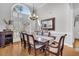 Formal dining room with hardwood floors, large window, and elegant chandelier at 1449 Waterside Ct, Mount Pleasant, SC 29464