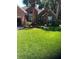 Brick home with palm trees and well-manicured lawn at 1449 Waterside Ct, Mount Pleasant, SC 29464