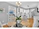 Modern kitchen with white cabinets, stainless steel appliances, and gray backsplash at 1449 Waterside Ct, Mount Pleasant, SC 29464