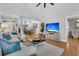 Open living space with hardwood floors, neutral decor, and views to dining area at 1449 Waterside Ct, Mount Pleasant, SC 29464