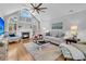Spacious living room with hardwood floors, fireplace, and large windows at 1449 Waterside Ct, Mount Pleasant, SC 29464