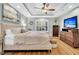 Main bedroom with hardwood floors, large TV, and neutral decor at 1449 Waterside Ct, Mount Pleasant, SC 29464