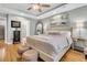 Main bedroom with hardwood floors, ensuite bathroom access, and neutral decor at 1449 Waterside Ct, Mount Pleasant, SC 29464