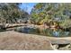 Serene pond with fountain and stone bench at 1449 Waterside Ct, Mount Pleasant, SC 29464