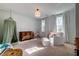 Bedroom with crib, rocking chair, and soft color scheme at 1525 Kepley Dr, Mount Pleasant, SC 29464