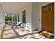 Relaxing front porch with seating and brick flooring at 1525 Kepley Dr, Mount Pleasant, SC 29464