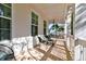 Spacious front porch with seating area and white railings at 1525 Kepley Dr, Mount Pleasant, SC 29464