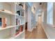 Bright hallway with built-in bookshelves and hardwood floors at 1525 Kepley Dr, Mount Pleasant, SC 29464