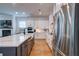 Modern kitchen with white cabinets, a large island with quartz countertop, and stainless steel appliances at 1525 Kepley Dr, Mount Pleasant, SC 29464